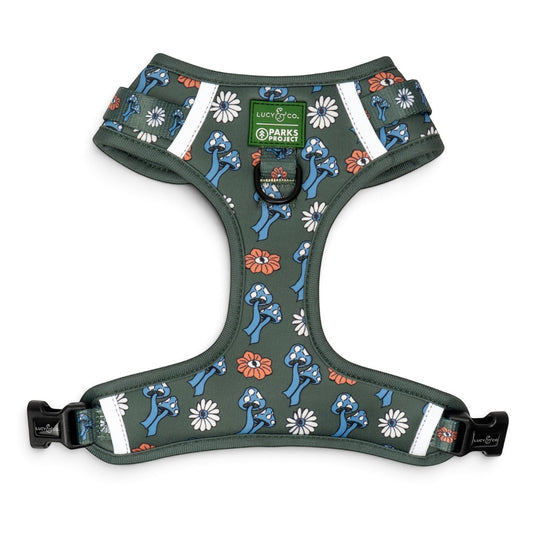 Lucy & Co. x Parks Project no-pull dog harness in olive green with a mushroom and daisy print and reflective trim.