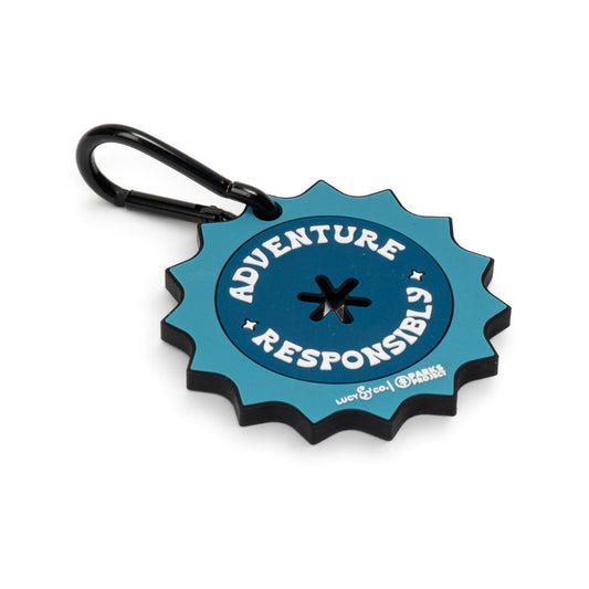Lucy & Co. x Parks Project blue rubber poop bag clip with Adventure Responsibly text and black metal carabiner