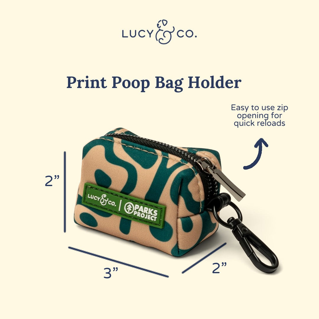 Lucy & Co. x Parks Project Geyser print neoprene poop bag holder with a zipper and black clip for dog leashes.