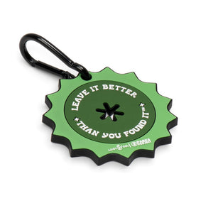 Lucy & Co. x Parks Project green rubber poop bag clip with a black metal carabiner and Leave it Better text design.