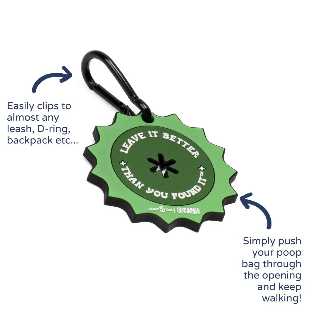 Lucy & Co. green rubber poop bag clip with Leave it Better text and a black metal carabiner for dog leashes.