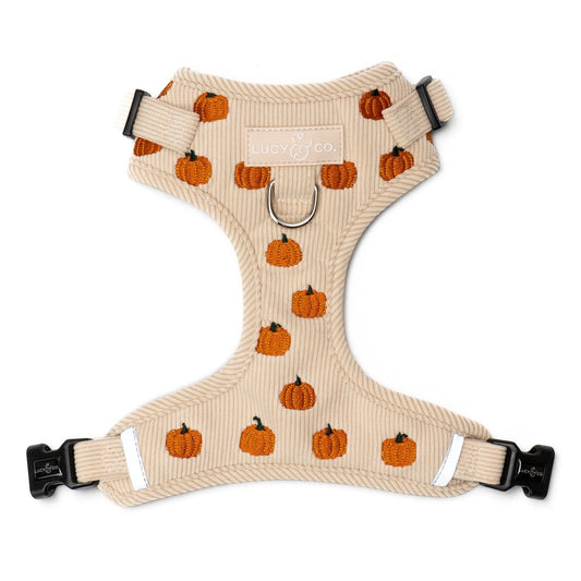 Lucy & Co. beige corduroy dog harness featuring an embroidered pumpkin pattern and front leash attachment point.
